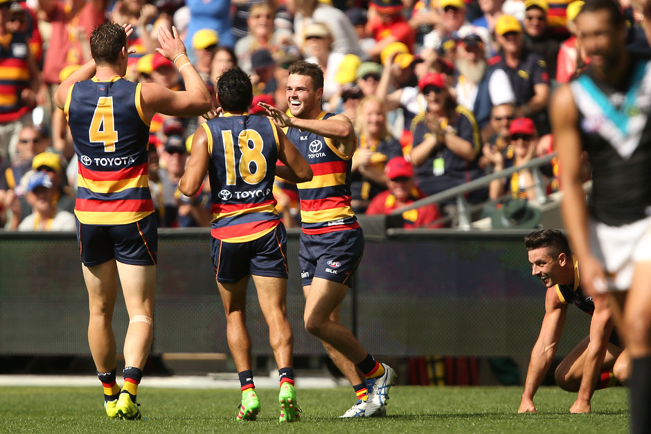 AFL 2016 Rd 02 - Adelaide v Port Adelaide ADELAIDE, AUSTRALIA - APRIL 2: Brad Crouch of the Crows celebrates a goal during the 2016 AFL Round 02 match between the Adelaide Crows and Port Adelaide Power at the Adelaide Oval, Adelaide on April 2, 2016. (Photo by James Elsby/AFL Media)
